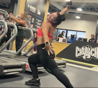 a woman doing a workout in a gym