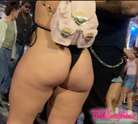 a woman in a bikini with a backpack