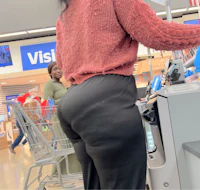 a woman with a big butt standing in a grocery store