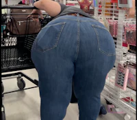 a woman in a pair of jeans standing in a store
